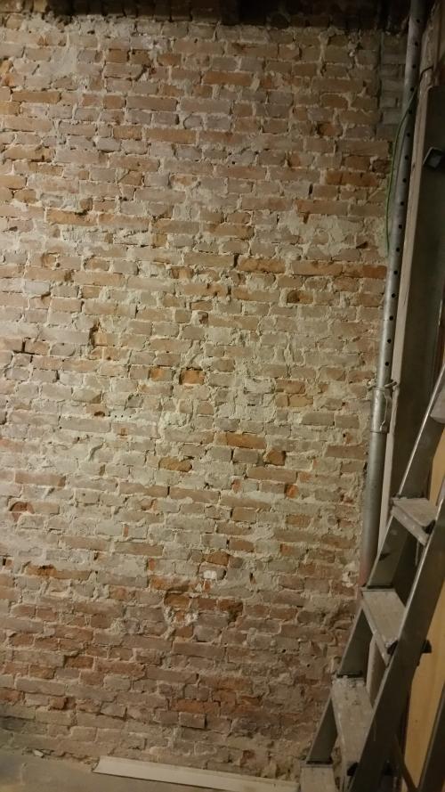 The bare brick wall where the meter cupboard will be built.