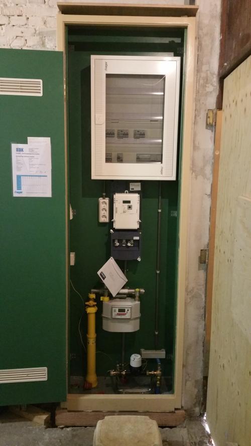 The completed utility meter cupboard on 17 October 2017, with the distribution board, meters and pipework.